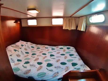 At the back of the boat is the captains cabin with a double bed ().