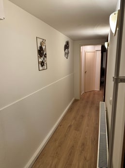 Corridor after the 3 bedrooms and 2 showers. 2nd toilet also downstairs, washing machine and dryer also available.