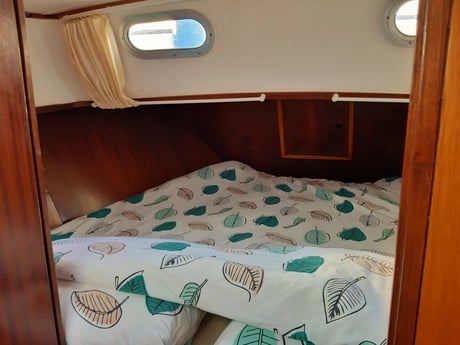At the front of the boat is a double bed ().